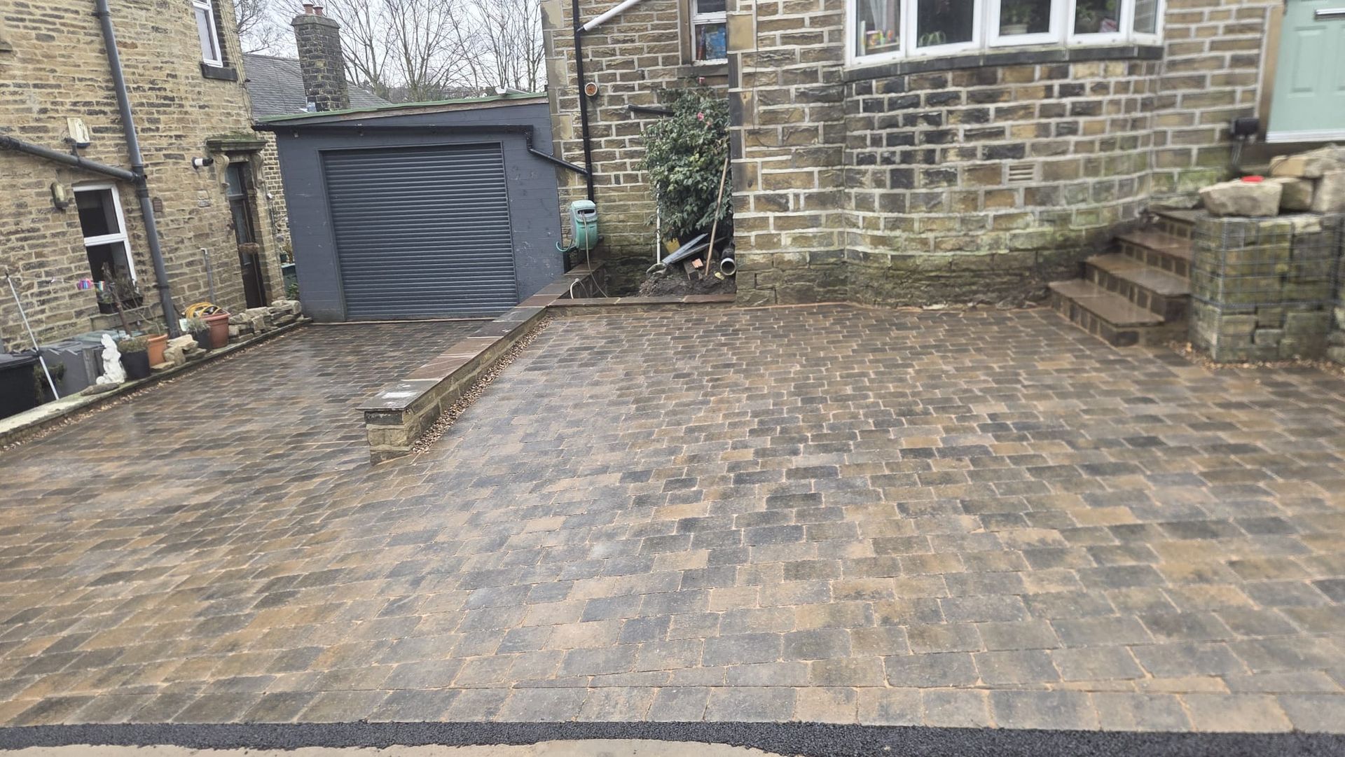Plaspave Sorrento Sarsen Stone paving with reused stone walls and steps in Howarth