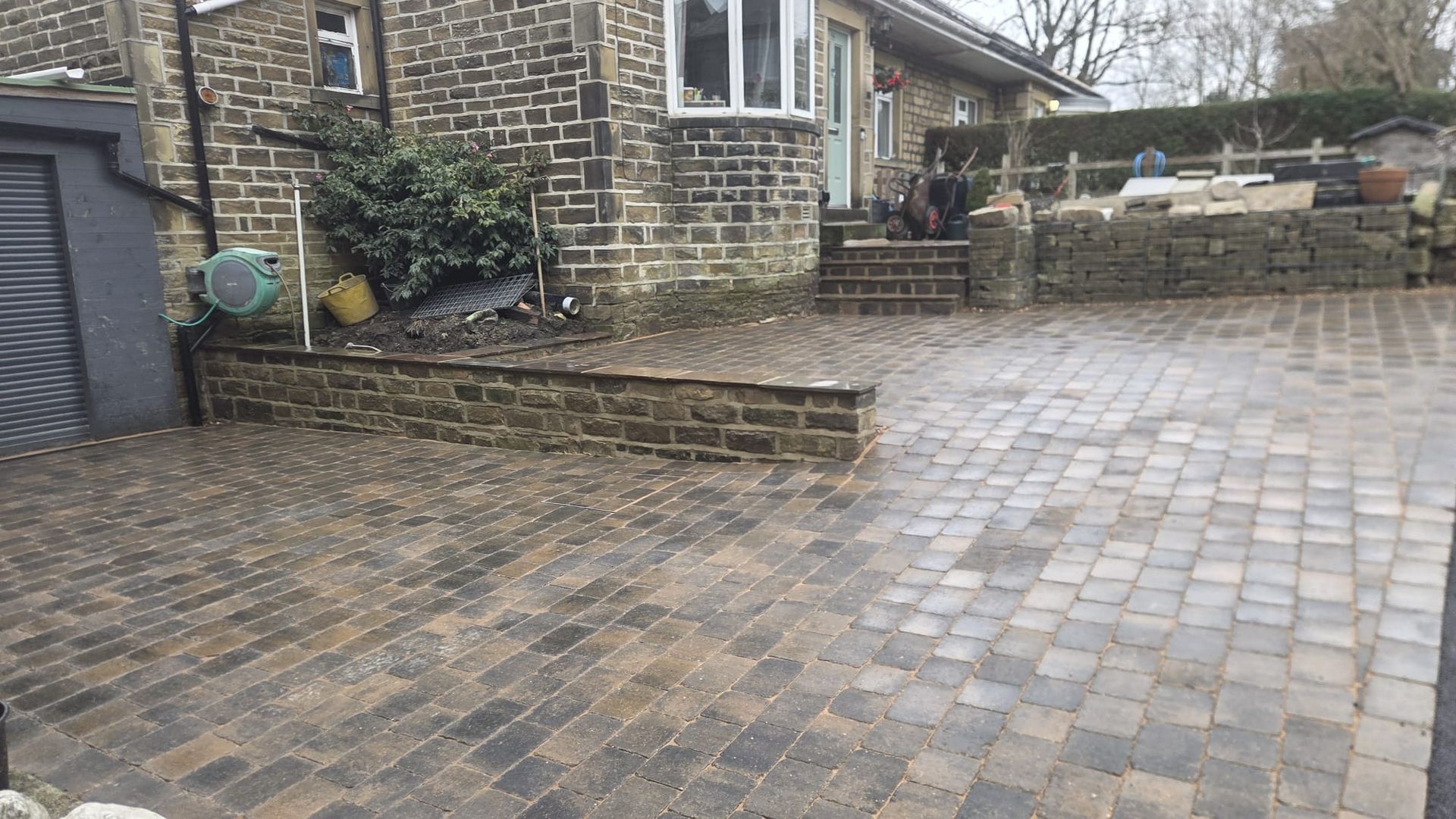 Plaspave Sorrento Sarsen Stone paving with reused stone walls and steps in Howarth