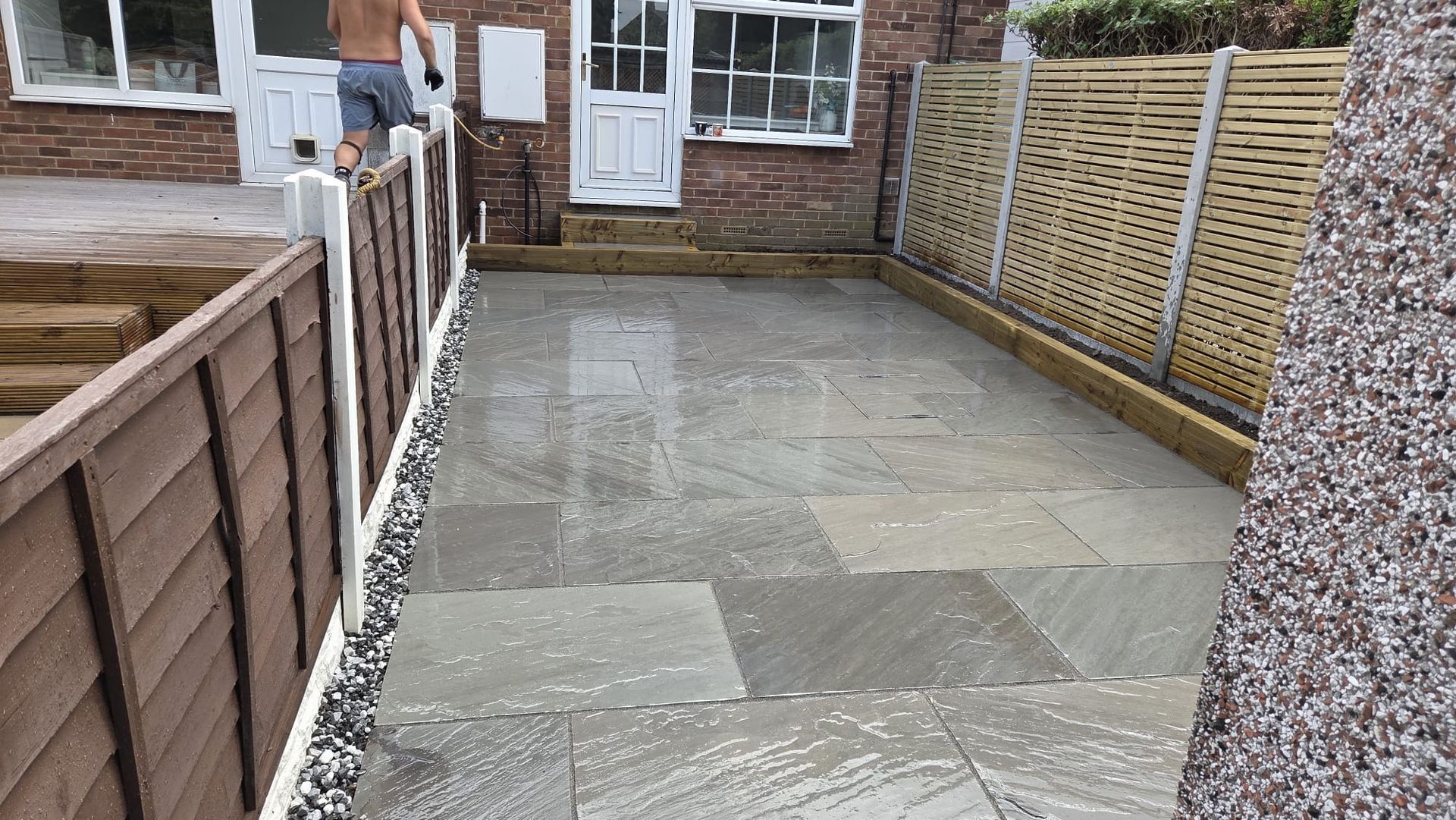 Kandla Grey Indian stone with fencing, sleeper planters and steps in Farsley