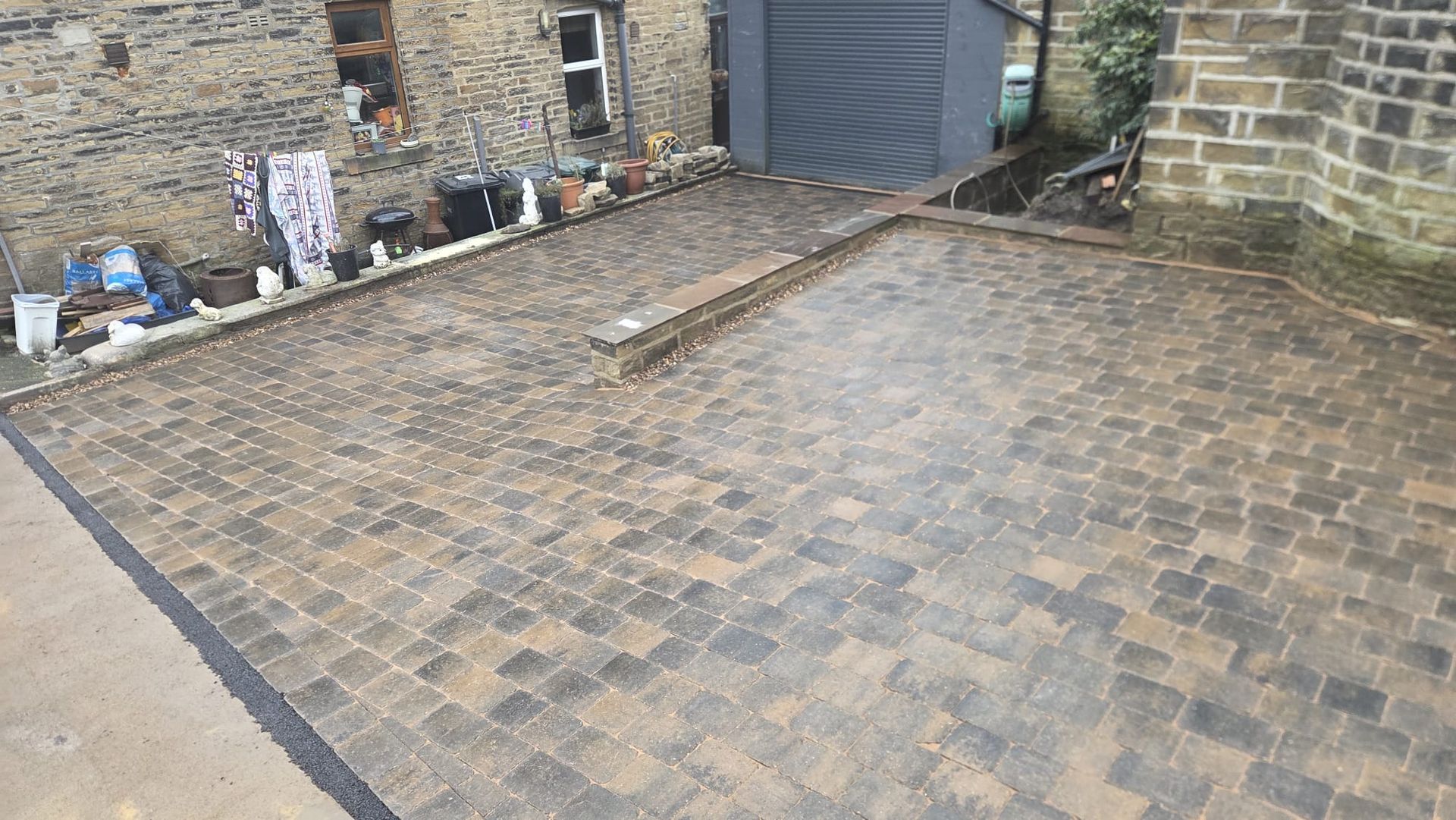 Plaspave Sorrento Sarsen Stone paving with reused stone walls and steps in Howarth