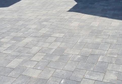Grey block paving driveway in Farsley with integrated entrance steps and additional off-road parking