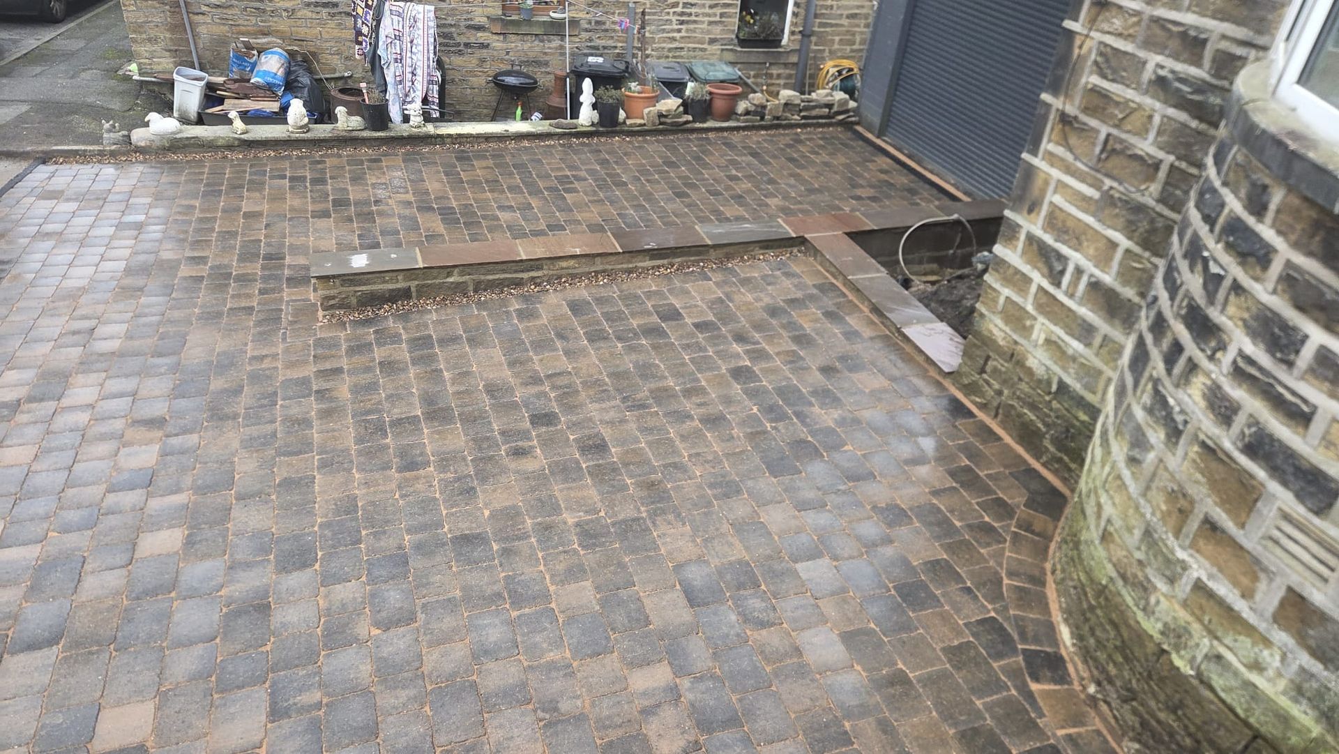 Plaspave Sorrento Sarsen Stone paving with reused stone walls and steps in Howarth