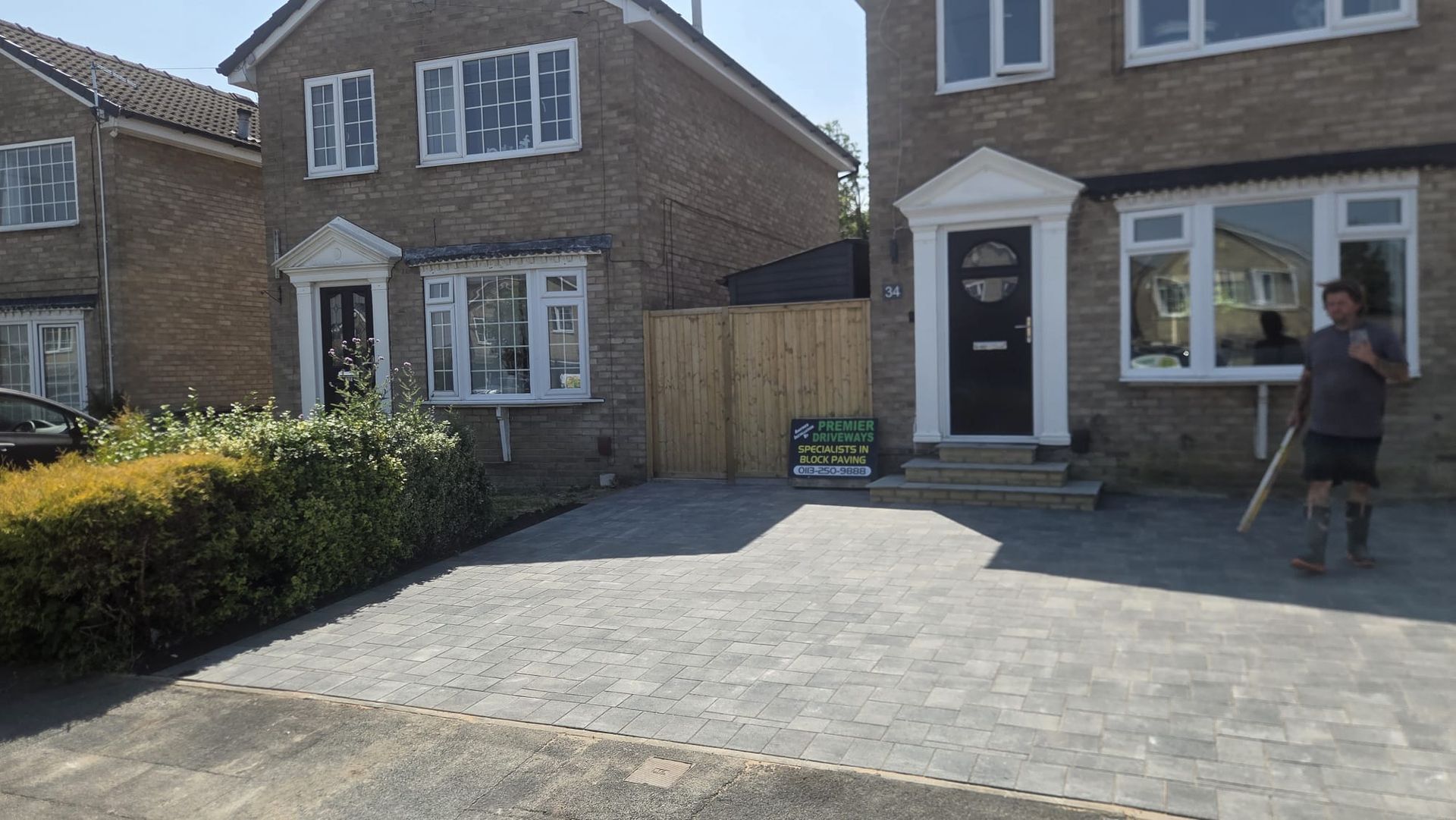 Grey block paving driveway in Farsley with integrated entrance steps and additional off-road parking