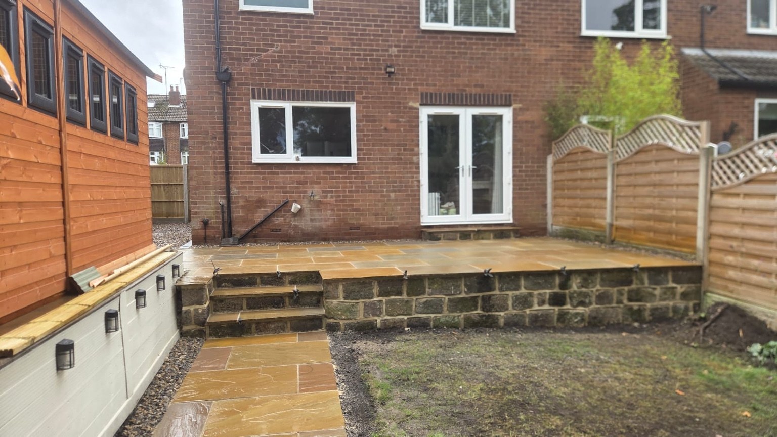 Raised Indian stone patio at the rear of the Cookridge home